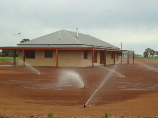 Sprinklers running on a newly prepared yard