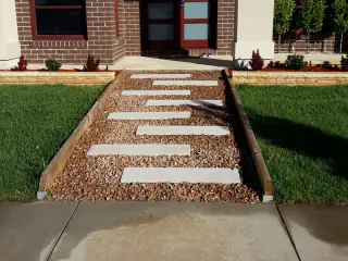 Paved stepping path through a new front lawn